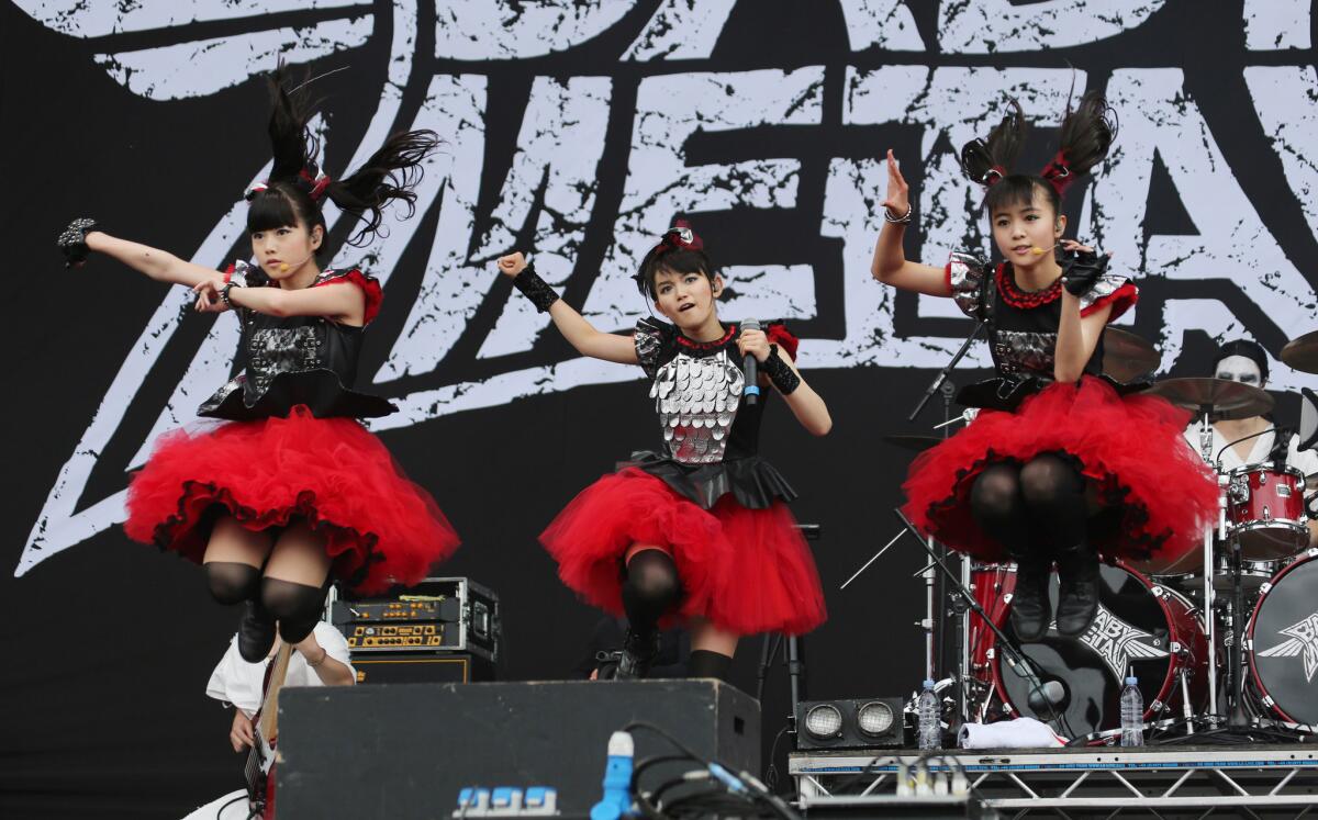 Yuimetal, Su-metal and Moametal of Babymetal perform at the Sonisphere Festival in England.