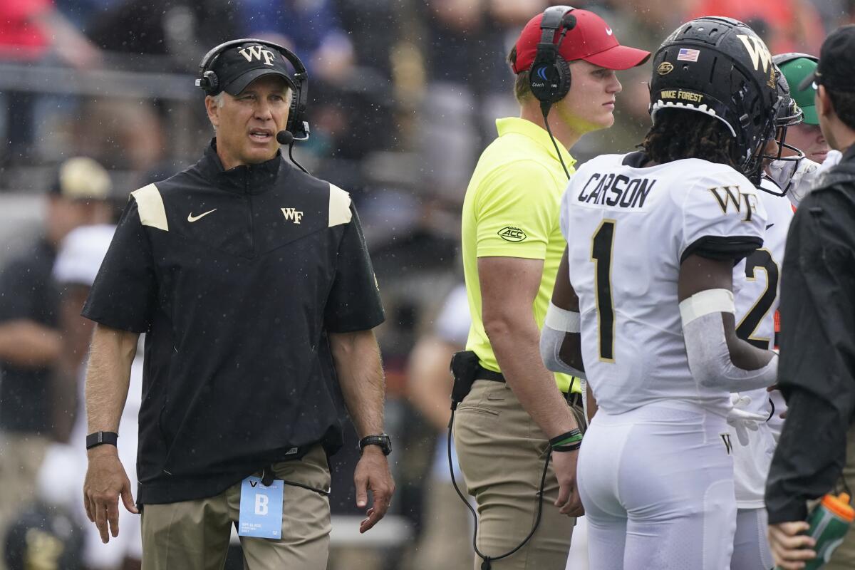 Wake Forest head coach Dave Clawson waits for play to resume in the first half of an NCAA college football game against Vanderbilt Saturday, Sept. 10, 2022, in Nashville, Tenn. (AP Photo/Mark Humphrey)