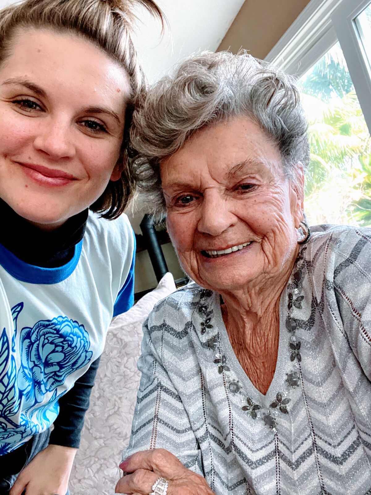 GoldenTalk volunteer Rachel Woods-Oshiro, left, pictured with her grandmother, has been helping founder Kimberly Lewis coordinate the senior chat and crisis line's almost 200 volunteers.
