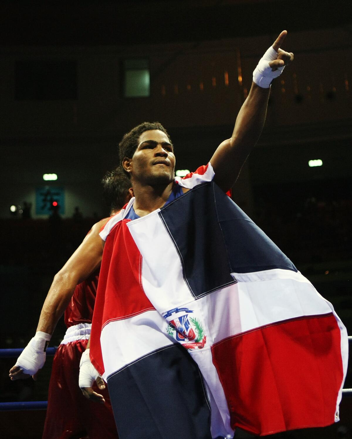 BEIJING - AUGUST 23: Felix Diaz of Dominican Republic celebrates victory against Manus Boonjumnong of Thailand in the Men's Light Welter (64kg) Final Bout held at Workers' Indoor Arena on Day 15 of the Beijing 2008 Olympic Games on August 23, 2008 in Beijing, China. (Photo by Nick Laham/Getty Images)