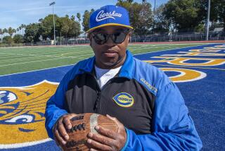 Robert Garrett, head coach of the Crenshaw High School varsity football team, is photographed.