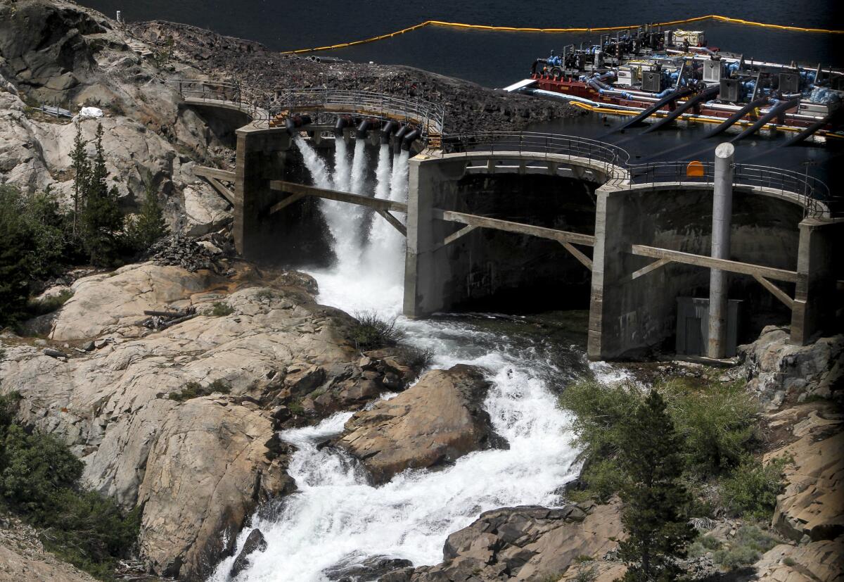 The snow is melting faster than the giant pumps can remove water from Agnew Lake in the mountains above June Lake.