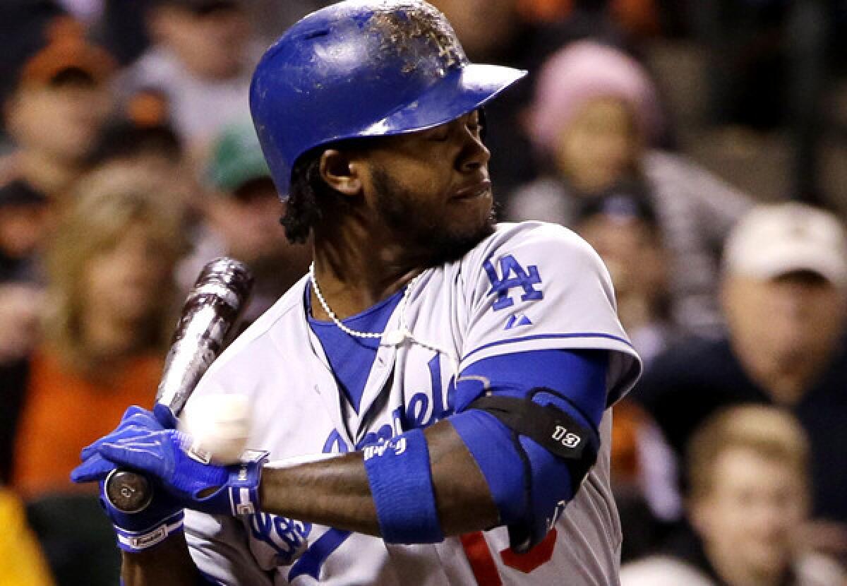Dodgers shortstop Hanley Ramirez is hit on top of his left hand by a pitch from Ryan Vogelsong in the seventh inning Wednesday night in San Francisco.
