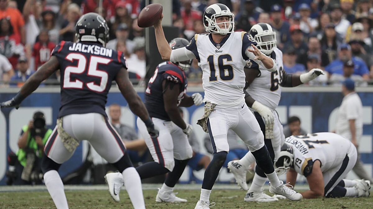 Rams quarterback Jared Goff overcomes a slow first half to throw for a career-best 355 yards against the Texans at the Coliseum.