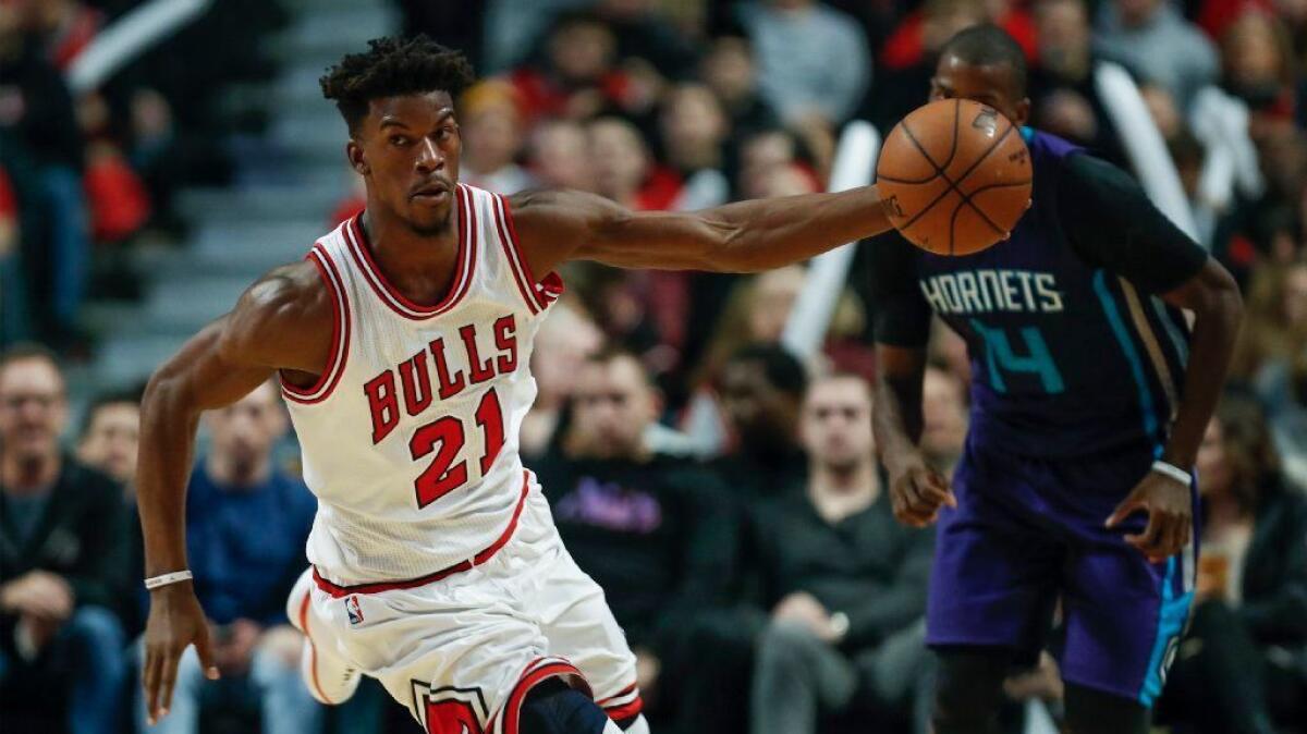 Bulls guard Jimmy Butler brings the ball up the court against the Hornets during a game in Chicago on Jan. 7.