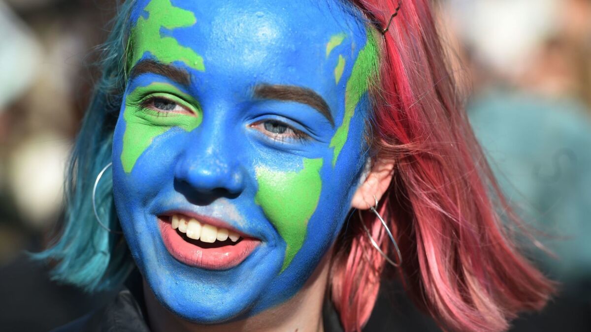 A student with her face painted participates in a climate change protest organized by 'Youth Strike 4 Climate' in London on Feb. 15.
