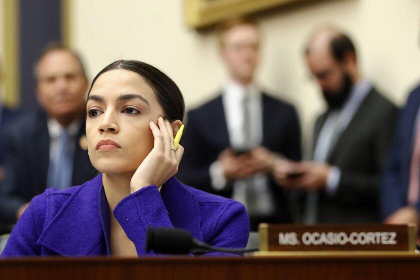 FILE - In this Wednesday, April 10, 2019, file photo, Rep. Alexandria Ocasio-Cortez, D-N.Y., listens during a House Financial Services Committee hearing with leaders of major banks on Capitol Hill in Washington. A second company has cut ties with a California minor league baseball team that played a Memorial Day video that included an image of Democratic Rep. Alexandria Ocasio-Cortez with images of Kim Jong Un and Fidel Castro. The Fresno Bee reports Heineken International confirmed in an email Thursday, May 30, 2019, it had ended its relationship with the Fresno Grizzlies. (AP Photo/Patrick Semansky, File)