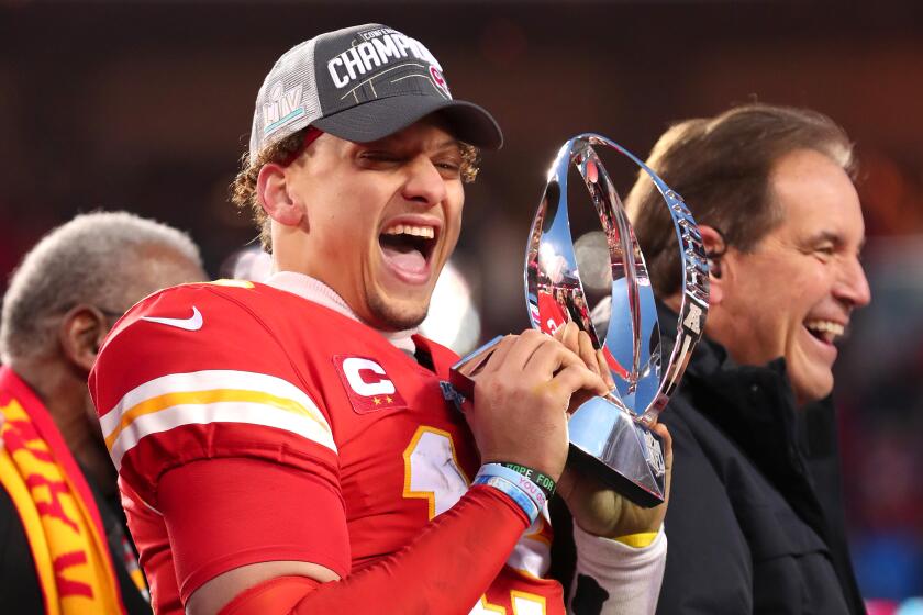 KANSAS CITY, MISSOURI - JANUARY 19: Patrick Mahomes #15 of the Kansas City Chiefs holds up the Lamar Hunt trophy after defeating the Tennessee Titans in the AFC Championship Game at Arrowhead Stadium on January 19, 2020 in Kansas City, Missouri. The Chiefs defeated the Titans 35-24. (Photo by Tom Pennington/Getty Images)