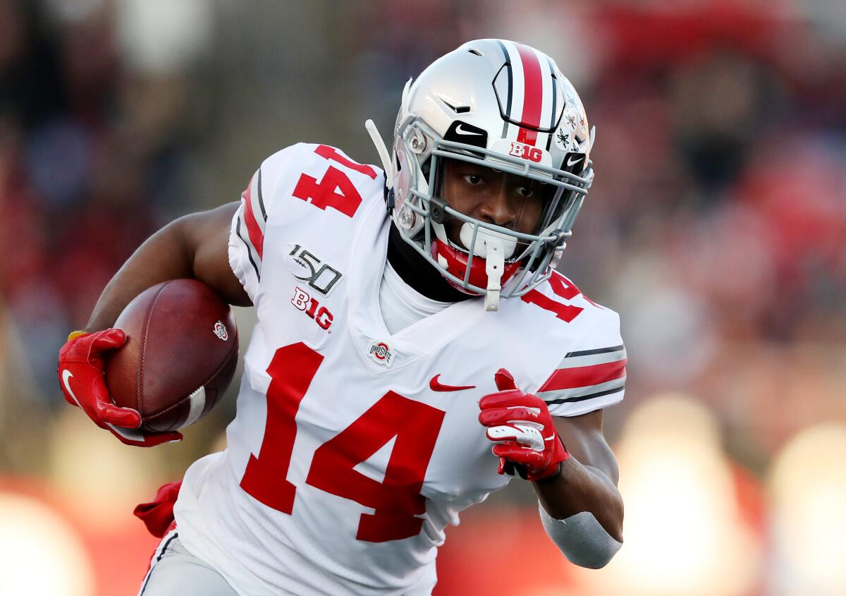 Ohio State receiver K.J. Hill runs with the ball during the first quarter of a game against Rutgers on Nov. 16. 