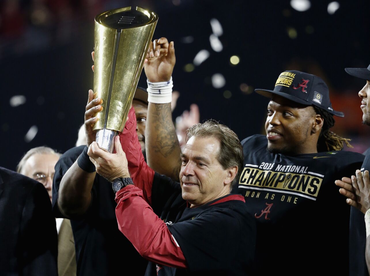 Alabama Coach Nick Saban hoists the College Football Playoff national championship trophy after defeating Clemson.