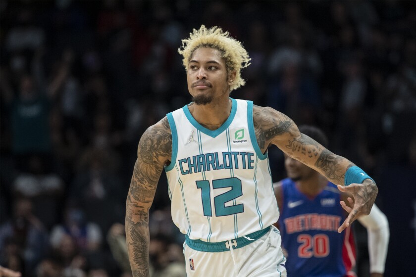 Charlotte Hornets guard Kelly Oubre Jr. (12) gestures after making a three point basket during the second half of an NBA basketball game against the Detroit Pistons, Wednesday, Jan. 5, 2022, in Charlotte, N.C. (AP Photo/Matt Kelley)