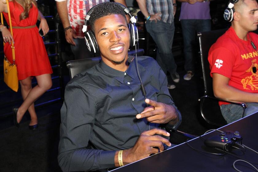 Lakers guard Nick Young attends a promotional event at LA Live in August. Young is expected to start Saturday in the Lakers' preseason opener.