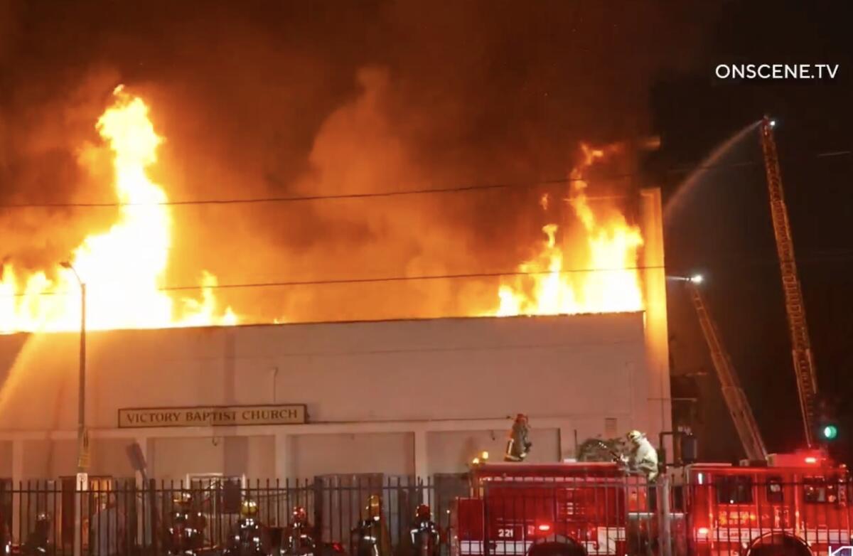 Fire crews battle flames at Victory Baptist Church.