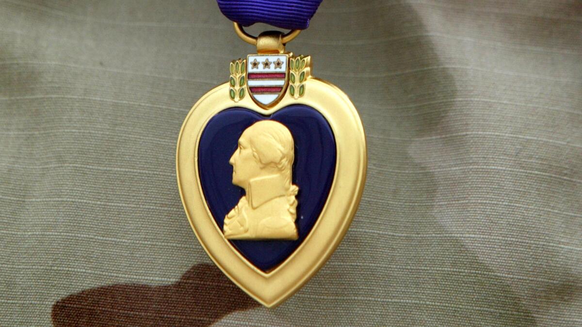 The Purple Heart was among the medals Elven Joe Swisher claimed to have received, the AP reported. One is seen here worn by an Army recipient in Baghdad in 2004.