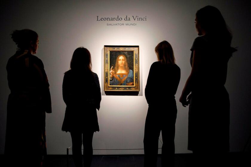 Christie's employees pose in front of a painting entitled Salvator Mundi by Italian polymath Leonardo da Vinci at a photocall at Christie's auction house in central London on October 22, 2017 ahead of its sale at Christie's New York on November 15, 2017. Salvator Mundi, one of fewer than 20 known paintings by da Vinci, and the only one in private hands, will be offered for sale in Christie's Post-War And Contemporary Art Evening Sale in New York and is estimated to realise in the region of 100 million USD (85 million euro; 76 million GBP). / AFP PHOTO / Tolga Akmen / RESTRICTED TO EDITORIAL USE - MANDATORY MENTION OF THE ARTIST UPON PUBLICATION - TO ILLUSTRATE THE EVENT AS SPECIFIED IN THE CAPTIONTOLGA AKMEN/AFP/Getty Images ** OUTS - ELSENT, FPG, CM - OUTS * NM, PH, VA if sourced by CT, LA or MoD **