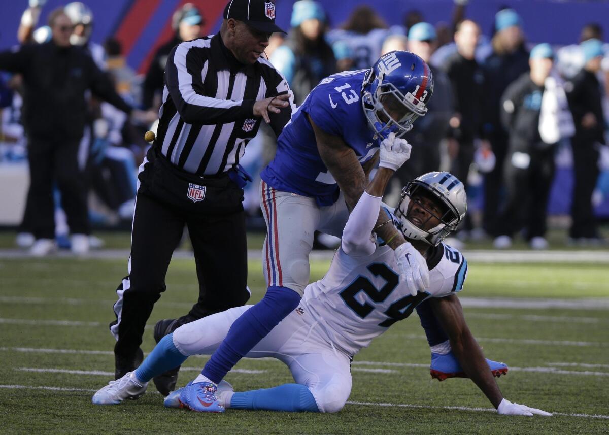 Josh Norman, right, and Odell Beckham Jr. scuffle during Sunday's game between the Carolina Panthers and the New York Giants.