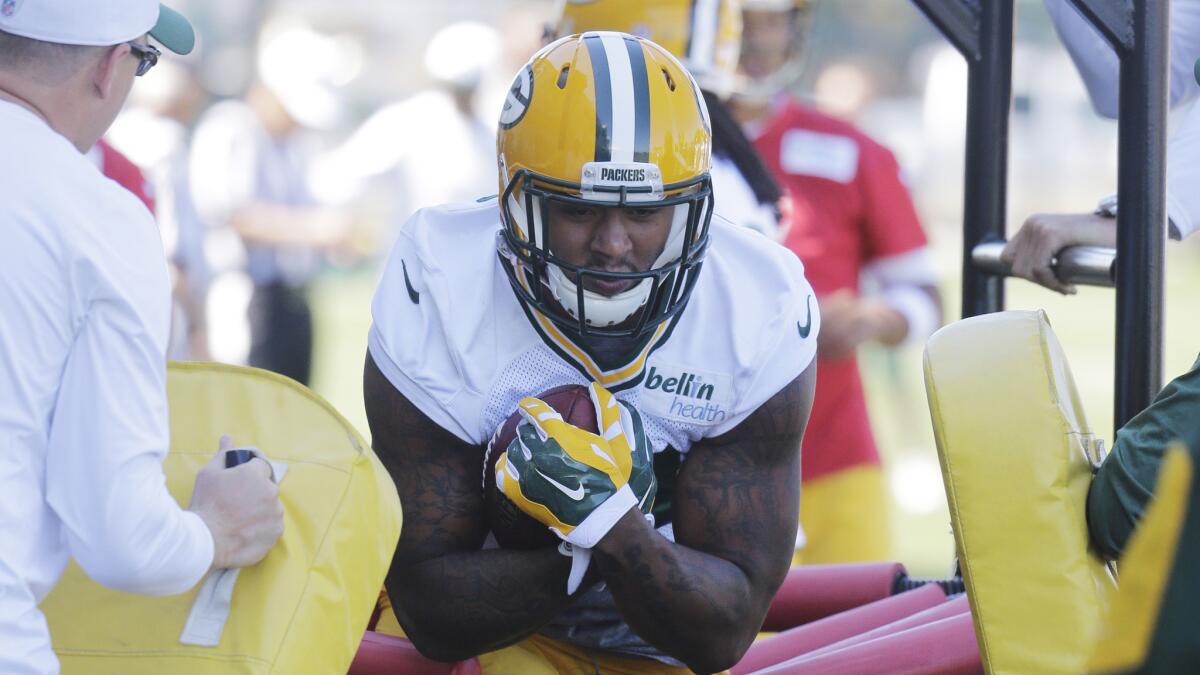 Green Bay Packers tight end Andrew Quarless runs through a drill during minicamp in Green Bay, Wis., on June 16.