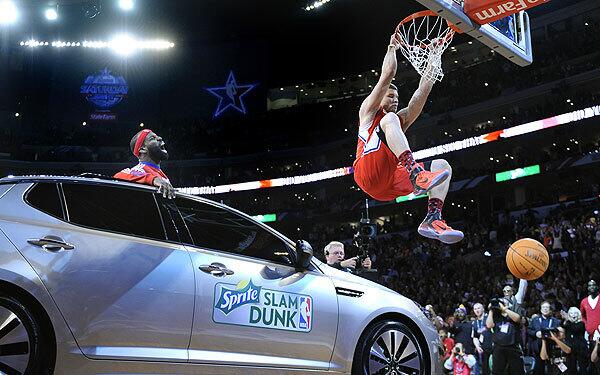 Blake Griffin wins slam dunk contest by jumping over a car