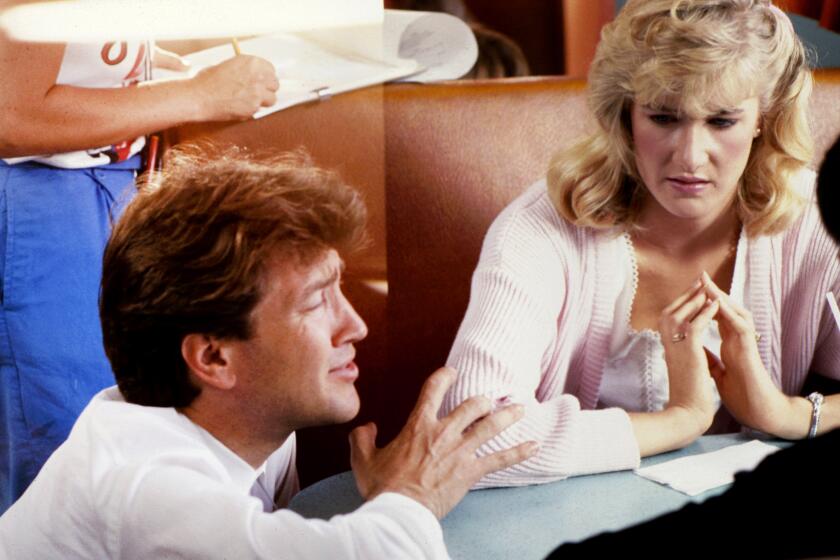 David Lynch directs Laura Dern in a scene for his 1986 movie, "Blue Velvet."