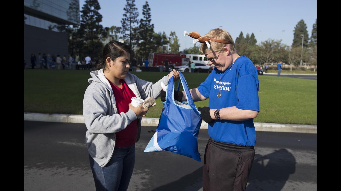 Photo Gallery: Hyundai gives away 2,000 turkeys to families in need