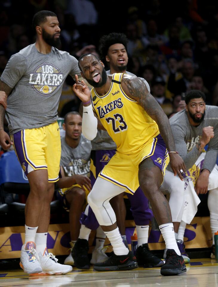 LeBron James celebrates getting fouled and making a three-pointer during the second half of a game against the Bucks on March 6 at Staples Center.