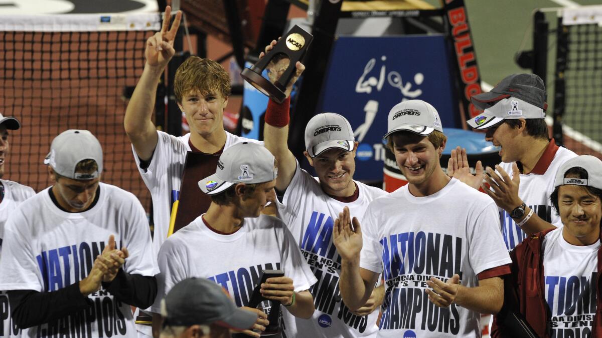USC tennis players celebrate their NCAA title victory over Oklahoma on Tuesday.