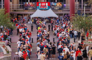 Trump supporters line up outside an area for a rally