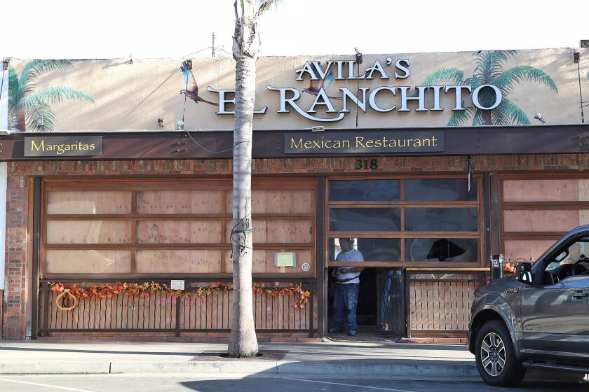 A two-alarm fire started in the kitchen of the popular Avila's El Ranchito on Wednesday morning in Huntington Beach.