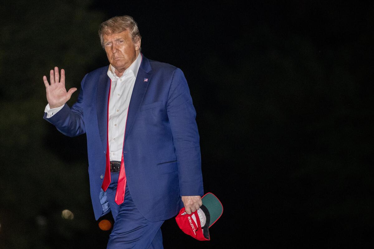 President Trump walks on the South Lawn of the White House on June 21.
