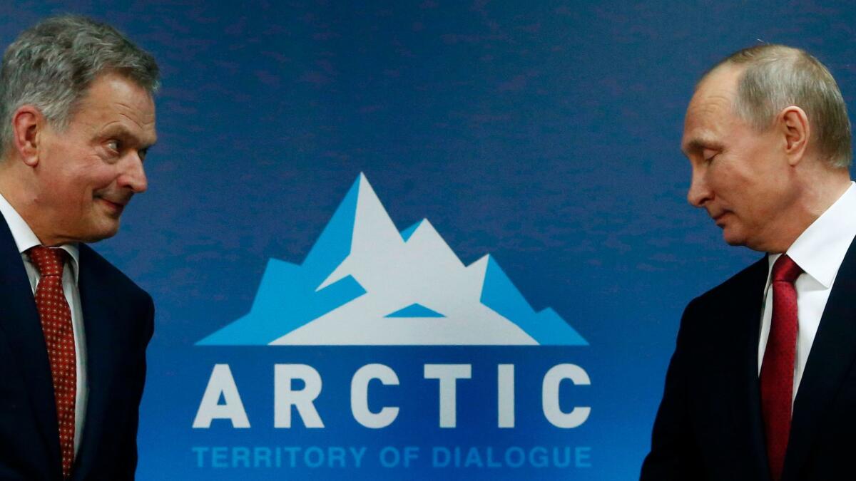 Russian President Vladimir Putin meets with Finnish President Sauli Niinisto during the International Arctic Forum in Arkhangelsk on March 30, 2017.