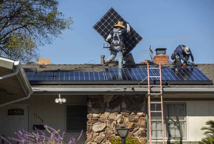 Rooftop solar panels are installed on a home in Granada Hills in 2020.