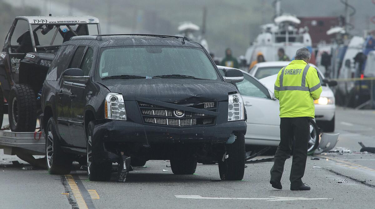 L.A. sheriff's investigators work the crash scene on Pacific Coast Highway where one woman was killed Feb. 7. Prosecutors are deciding whether Caitlyn Jenner, one of the drivers in the crash, will face charges.