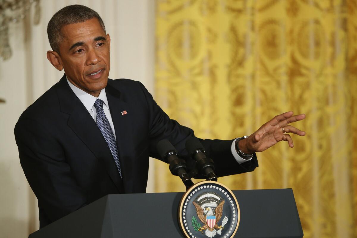 President Obama speaks during a news conference at the White House on Friday. He said he would not sign any law toughening sanctions against Iran while talks are in progress.