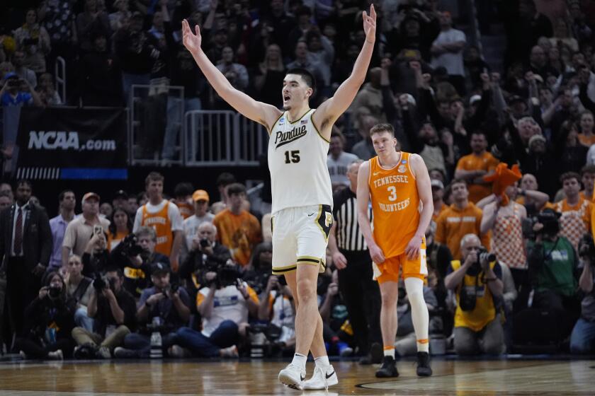 Purdue center Zach Edey (15) reacts near Tennessee guard Dalton Knecht (3) after the team defeated Tennessee in an Elite Eight college basketball game in the NCAA Tournament, Sunday, March 31, 2024, in Detroit. (AP Photo/Paul Sancya)