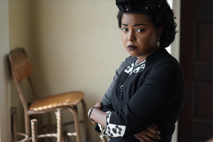 A grieving mother dressed in black.