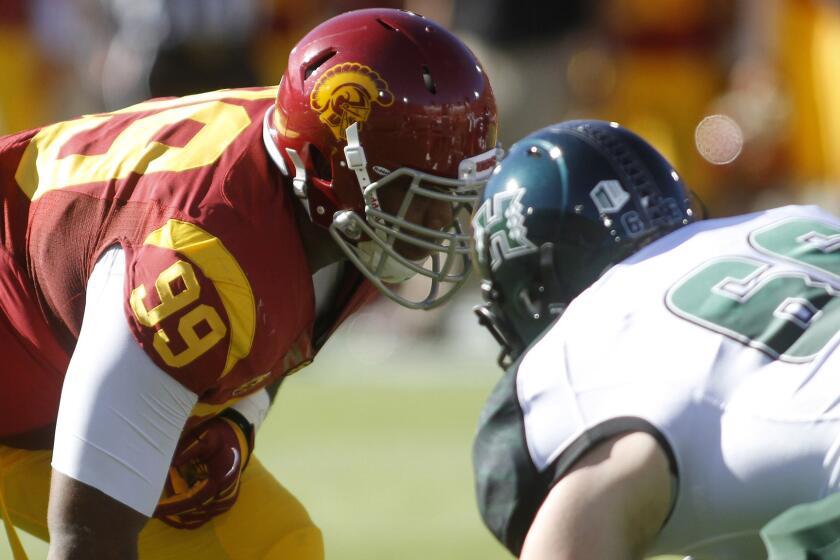 USC defensive lineman Antwaun Woods lines up during a game against Hawaii in on Sept. 1, 2012.