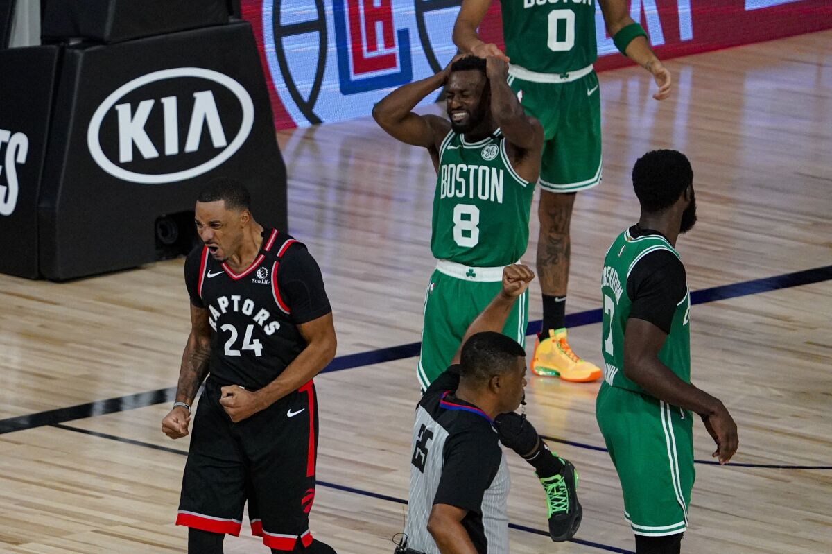 Toronto Raptors guard Norman Powell (24) celebrates after scoring and drawing a foul against the Boston Celtics during the second half of an NBA conference semifinal playoff basketball game Wednesday, Sept. 9, 2020, in Lake Buena Vista, Fla. (AP Photo/Mark J. Terrill)