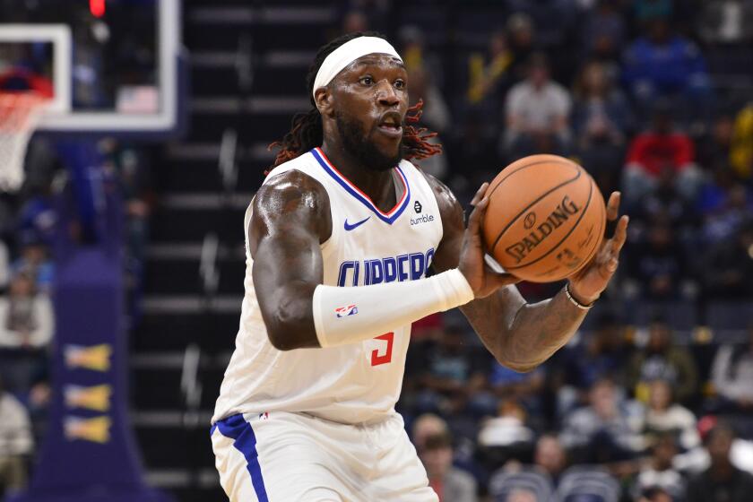 Los Angeles Clippers forward Montrezl Harrell (5) handles the ball during the first half of the team's NBA basketball game against the Memphis Grizzlies on Wednesday, Nov. 27, 2019, in Memphis, Tenn. (AP Photo/Brandon Dill)