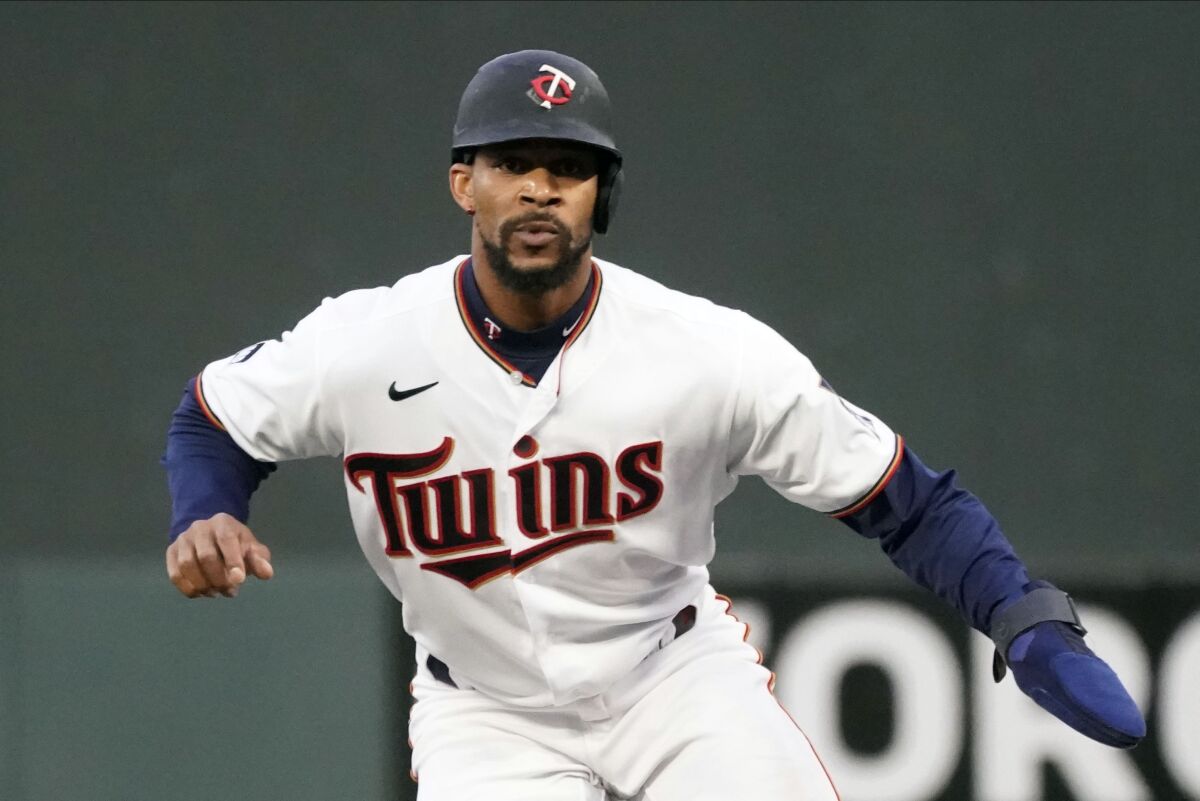 FILE -Minnesota Twins' Byron Buxton takes a lead at first base against the Toronto Blue Jays in a baseball game, Thursday, Sept. 23, 2021, in Minneapolis. The Minnesota Twins and center fielder Byron Buxton have agreed to a seven-year, $100 million contract, according to a person with knowledge of the deal, Sunday Nov. 28, 2021. (AP Photo/Jim Mone, File)