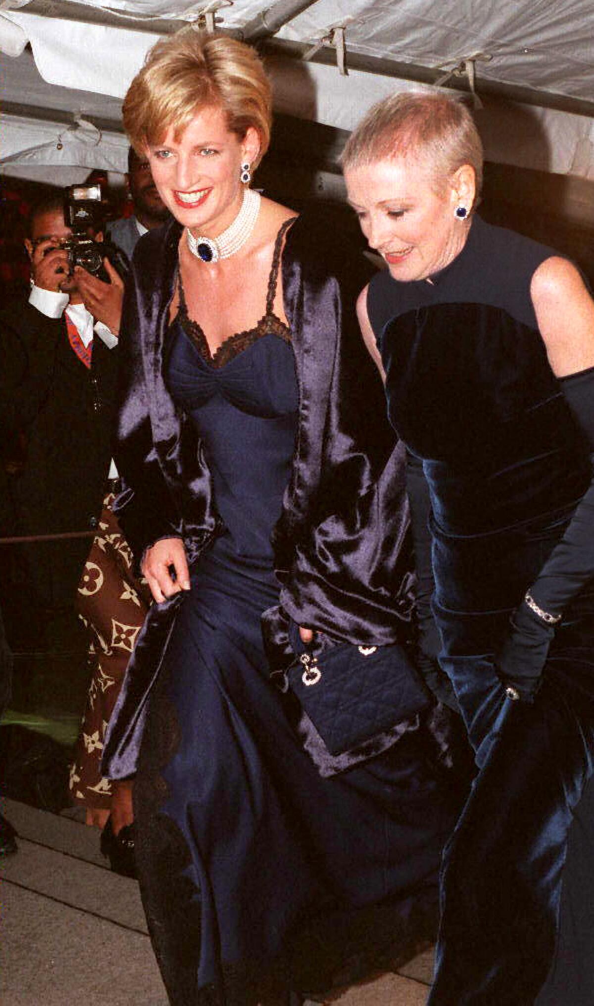 December 1996: Newly divorced Diana attends the Met Gala in a slinky navy blue slip dress by Christian Dior. 