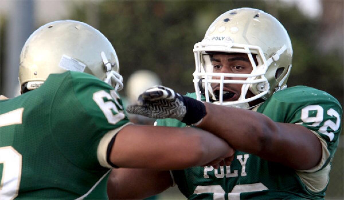 Joseph Wicker takes part in a drill during a Long Beach Poly practice on Sept. 25. Poly faces St. Bonaventure in a Pac-5 Division quarterfinal game Friday.