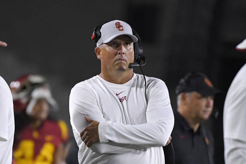 USC coach Clay Helton stands on the sideline during the Trojans' 31-23 victory over Fresno State on Saturday.