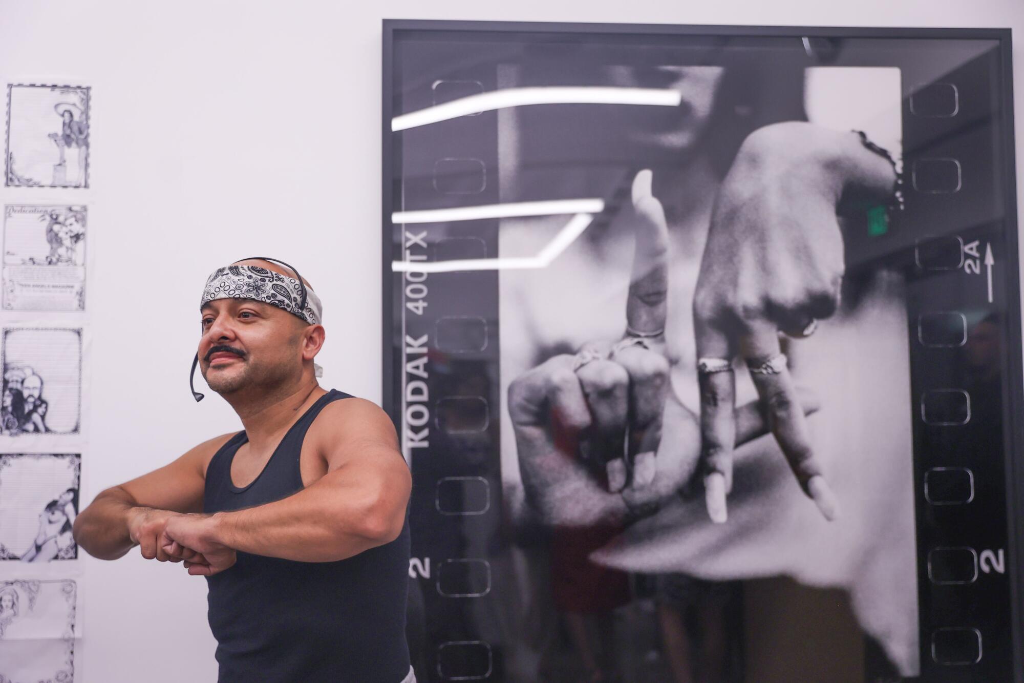 Frankie Quinones poses during the Beyond The Streets Gallery opening.