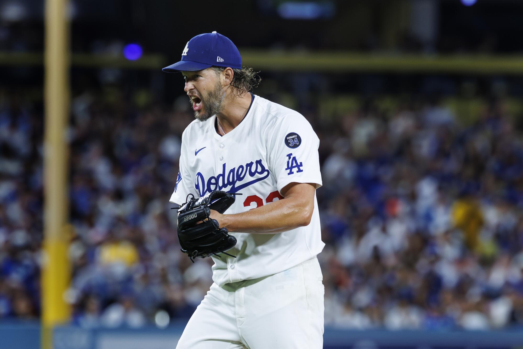 Kuvshin Doders Clayton Kershaw celebrates after he forces Gerard Encarnion San Francisco into a double game.