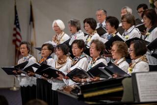 LAGUNA WOODS, CA - MAY 14, 2023: The church choir performs during the one-year anniversary memorial service for the Laguna Woods/Irvine Taiwanese Presbyterian Church shooting on May 14, 2023 at Geneva Presbyterian Church in Laguna Woods, California. (Gina Ferazzi / Los Angeles Times)