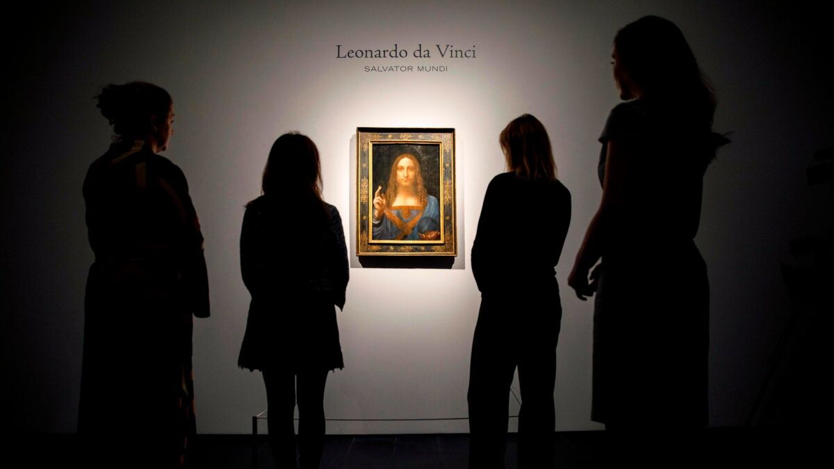 "Salvator Mundi" by Leonardo da Vinci hangs at Christie's auction house in London,