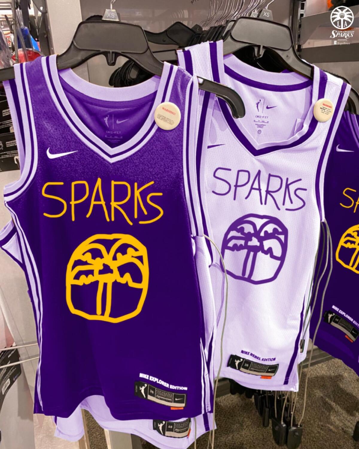Los Angeles Sparks April Fool's jerseys hanging on a rack