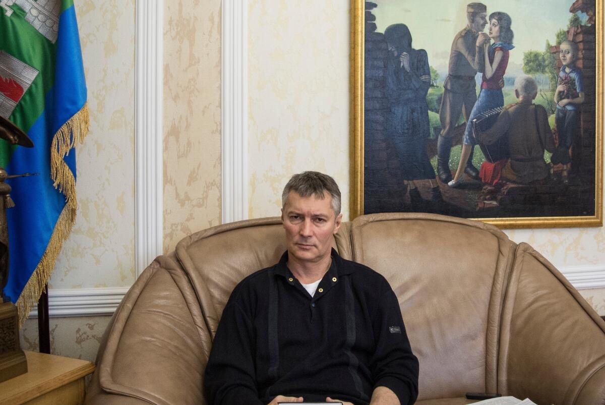 Yevgeny Roizman sits in his office in 2018.