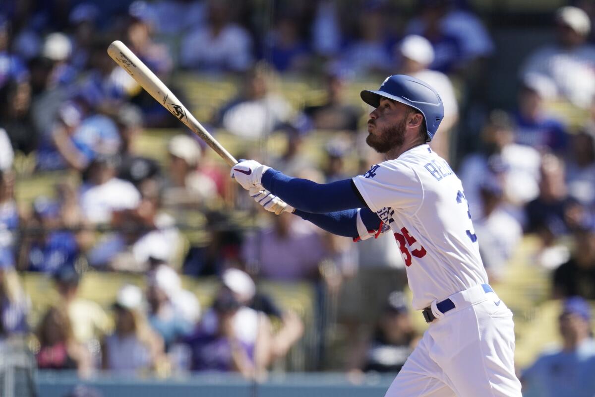 Los Angeles Dodgers' Cody Bellinger drives in a run with a sacrifice fly ball during the third inning.
