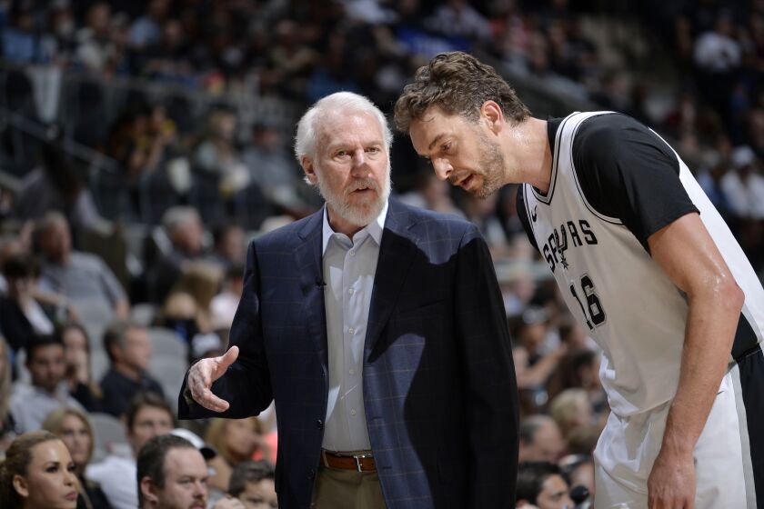 SAN ANTONIO, TX - MARCH 29: Pau Gasol #16 and Head Coach Gregg Popovich of the San Antonio Spurs talk during the game against the Oklahoma City Thunder on March 29, 2018 at the AT&T Center in San Antonio, Texas. NOTE TO USER: User expressly acknowledges and agrees that, by downloading and or using this photograph, user is consenting to the terms and conditions of the Getty Images License Agreement. Mandatory Copyright Notice: Copyright 2018 NBAE (Photos by Mark Sobhani/NBAE via Getty Images)